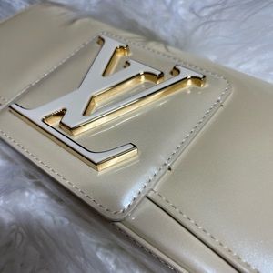 Authentic Louis Vuitton Sobe clutch.